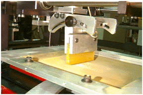 Systematic Automation's tilting squeegee attachement for screen printing machines